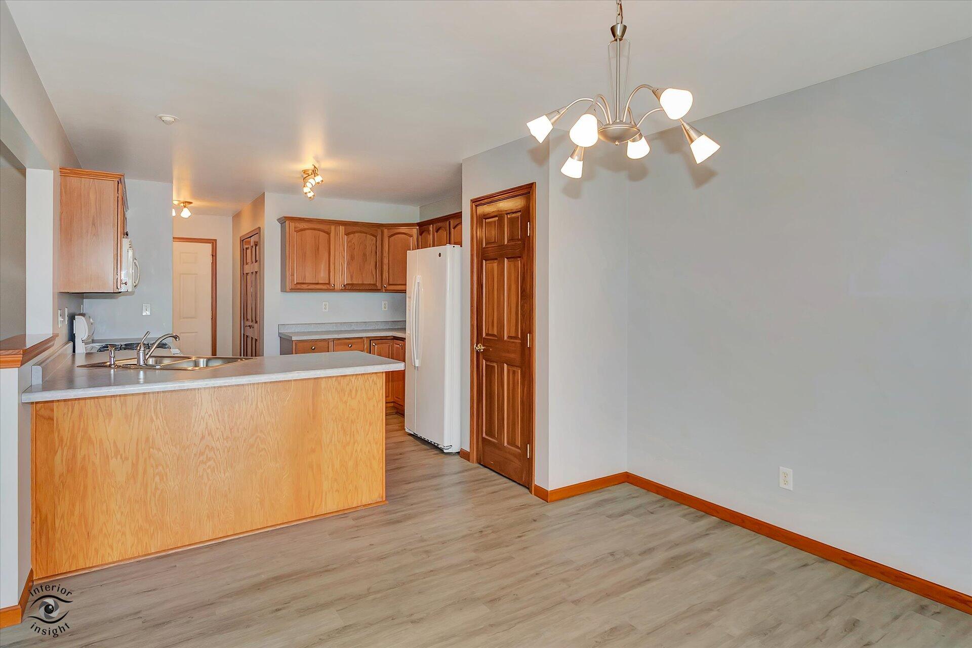 7646 Amanda's Way Crown Point, IN 46307 - Photo 7 of 26 a view of kitchen with wooden floor