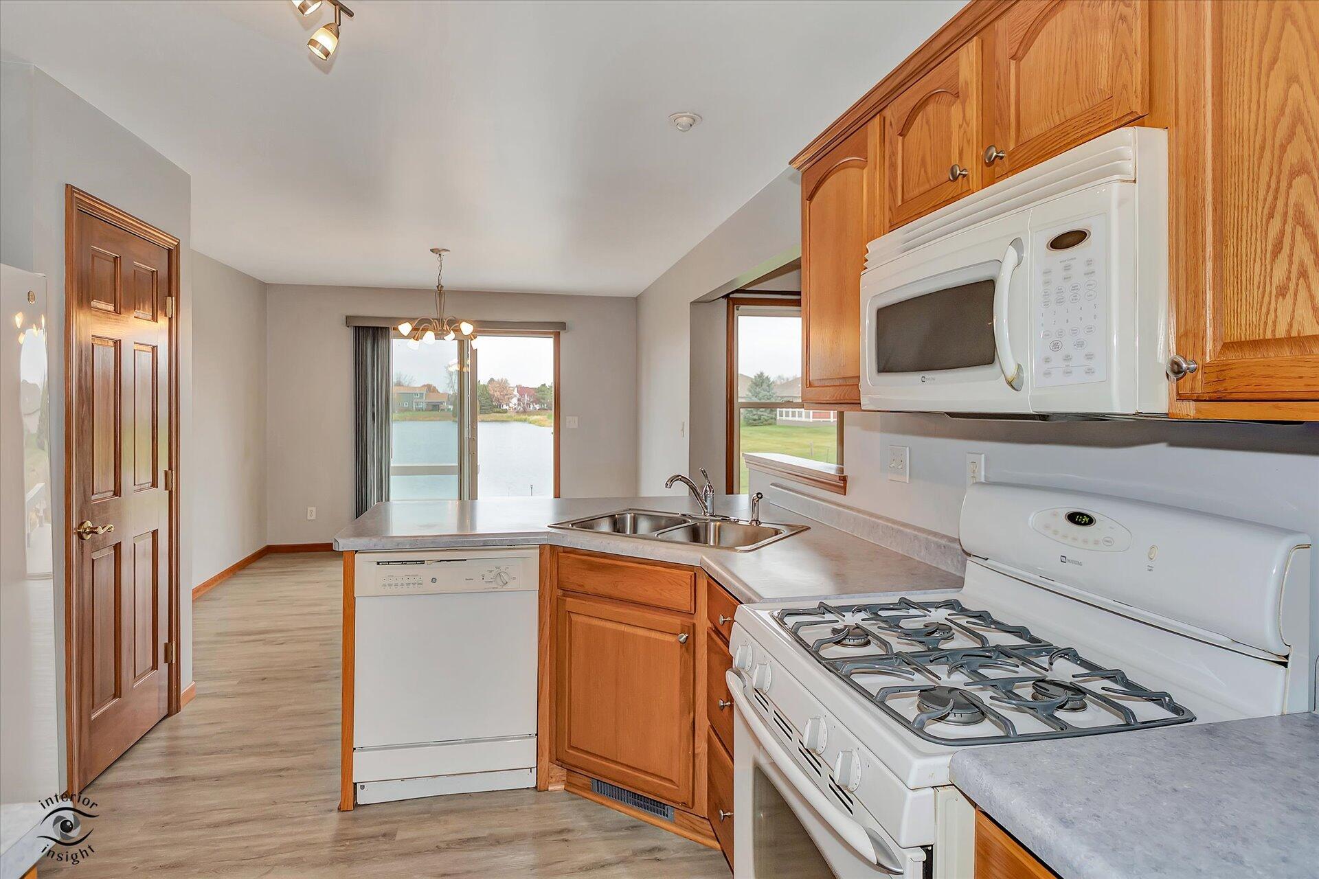7646 Amanda's Way Crown Point, IN 46307 - Photo 10 of 26 a kitchen that has a stove and a sink