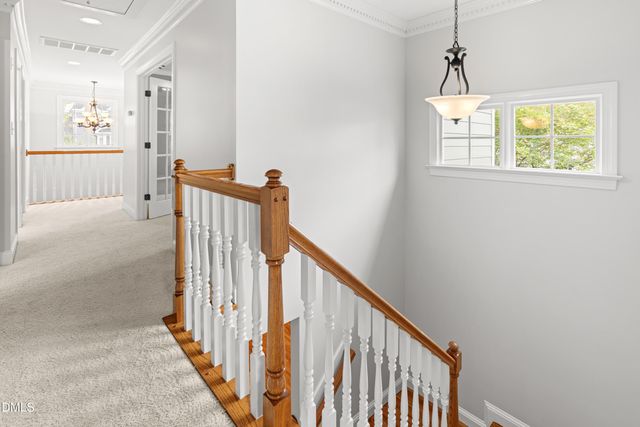 a view of a hallway with windows