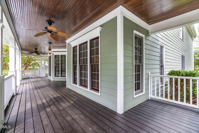 a view of a balcony with wooden floor