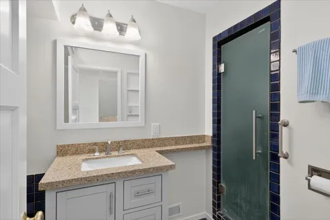 a bathroom with a sink and a mirror