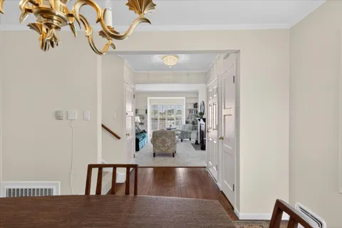 a view of livingroom and dining room with wooden floor