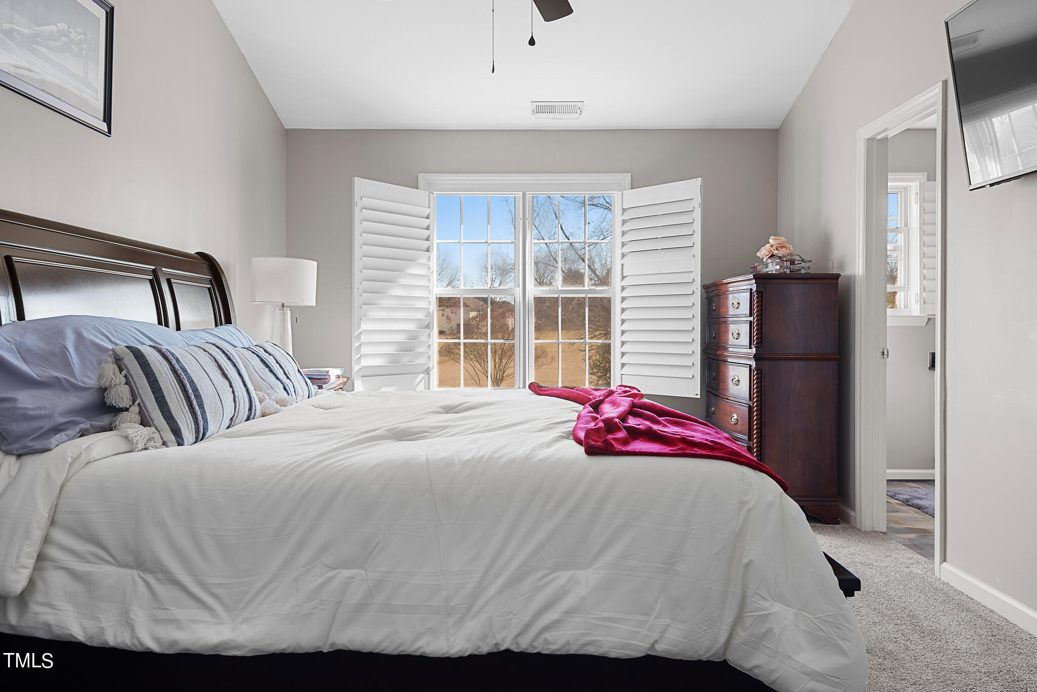 5324 Eagle Trace Drive Raleigh, NC 27604 - Photo 13 of 26 a bedroom with a bed and a window