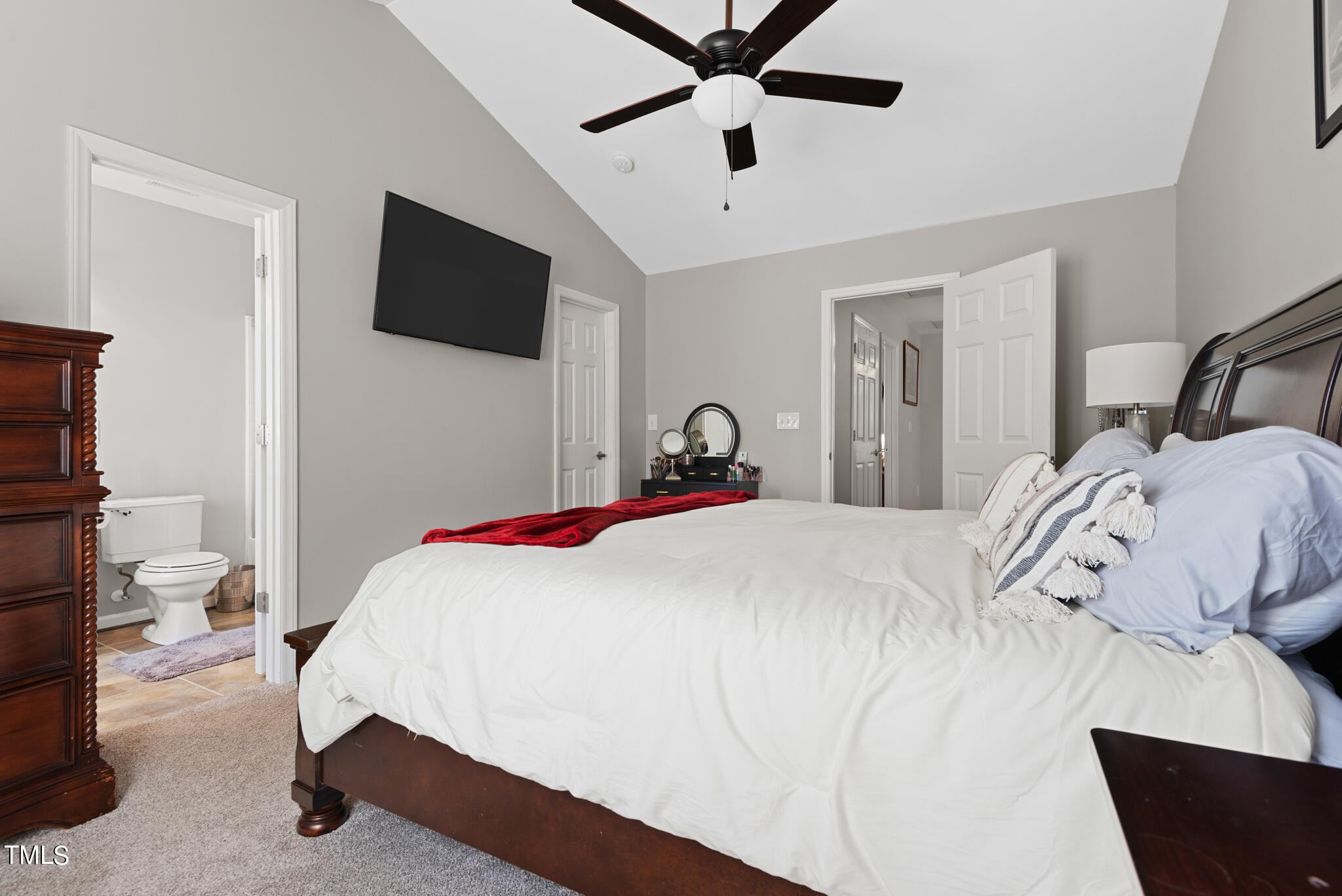 5324 Eagle Trace Drive Raleigh, NC 27604 - Photo 14 of 26 a bedroom with a bed and a flat tv screen