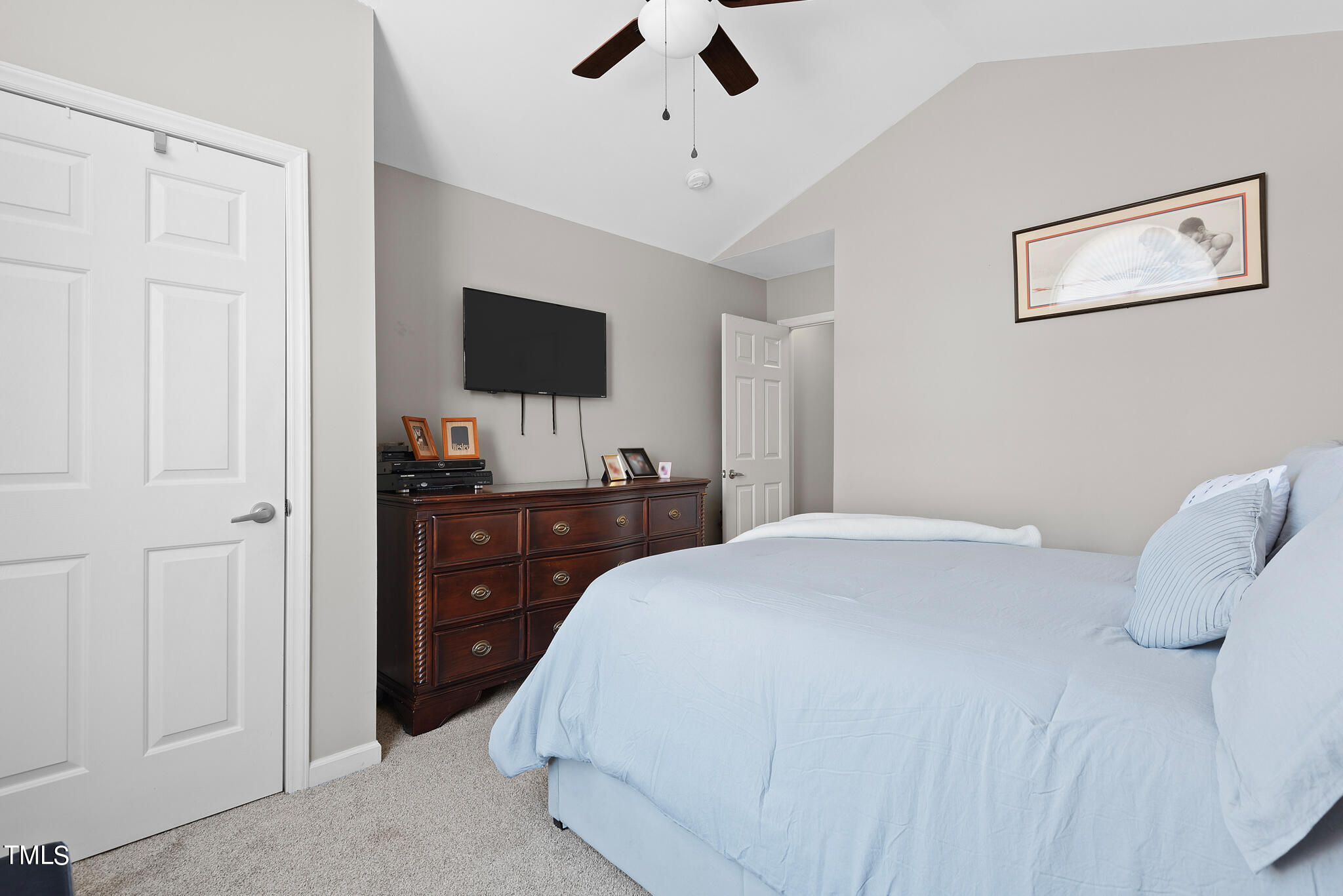 5324 Eagle Trace Drive Raleigh, NC 27604 - Photo 18 of 26 a bedroom with a bed and a flat screen tv