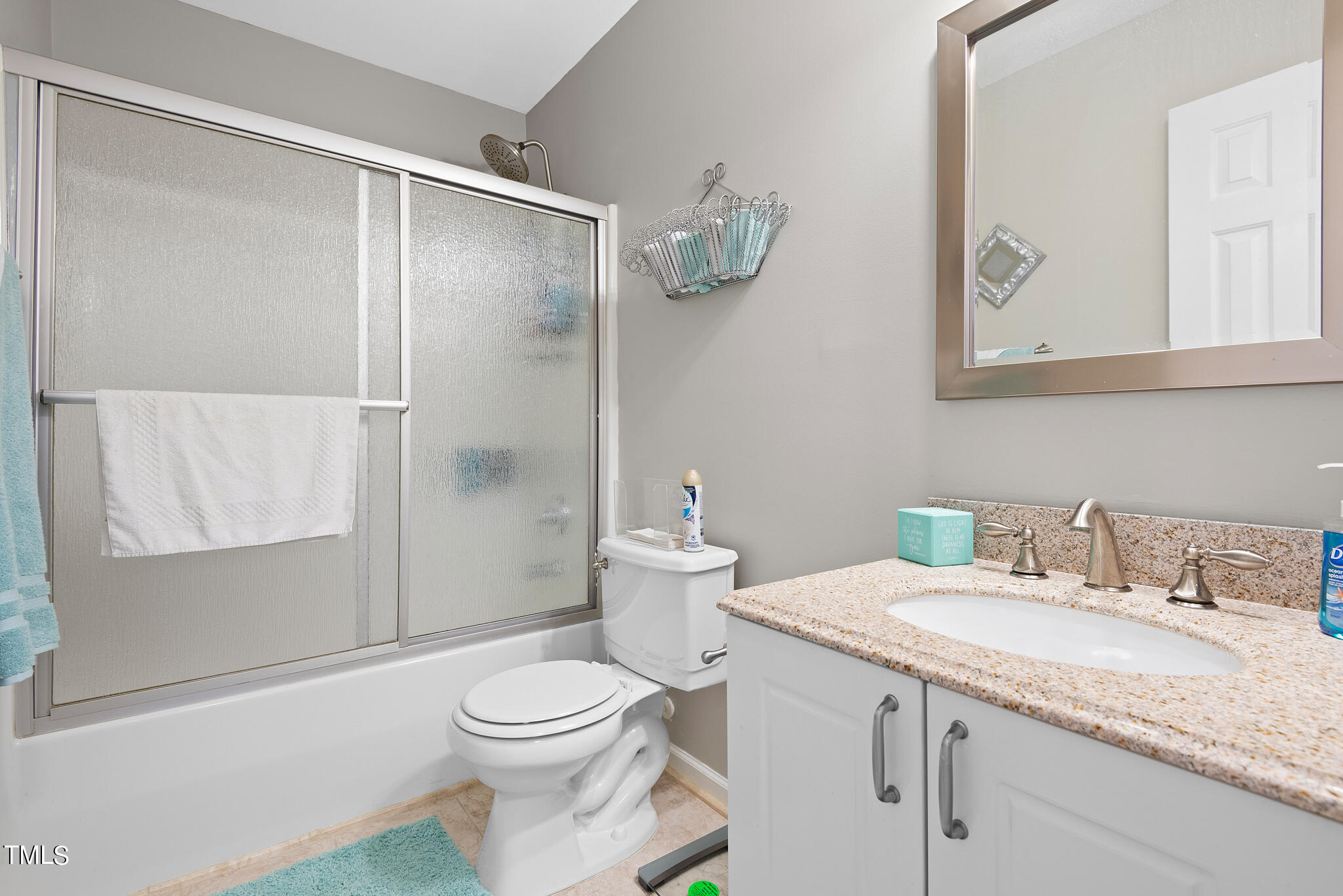 5324 Eagle Trace Drive Raleigh, NC 27604 - Photo 19 of 26 a bathroom with a granite countertop sink toilet and shower