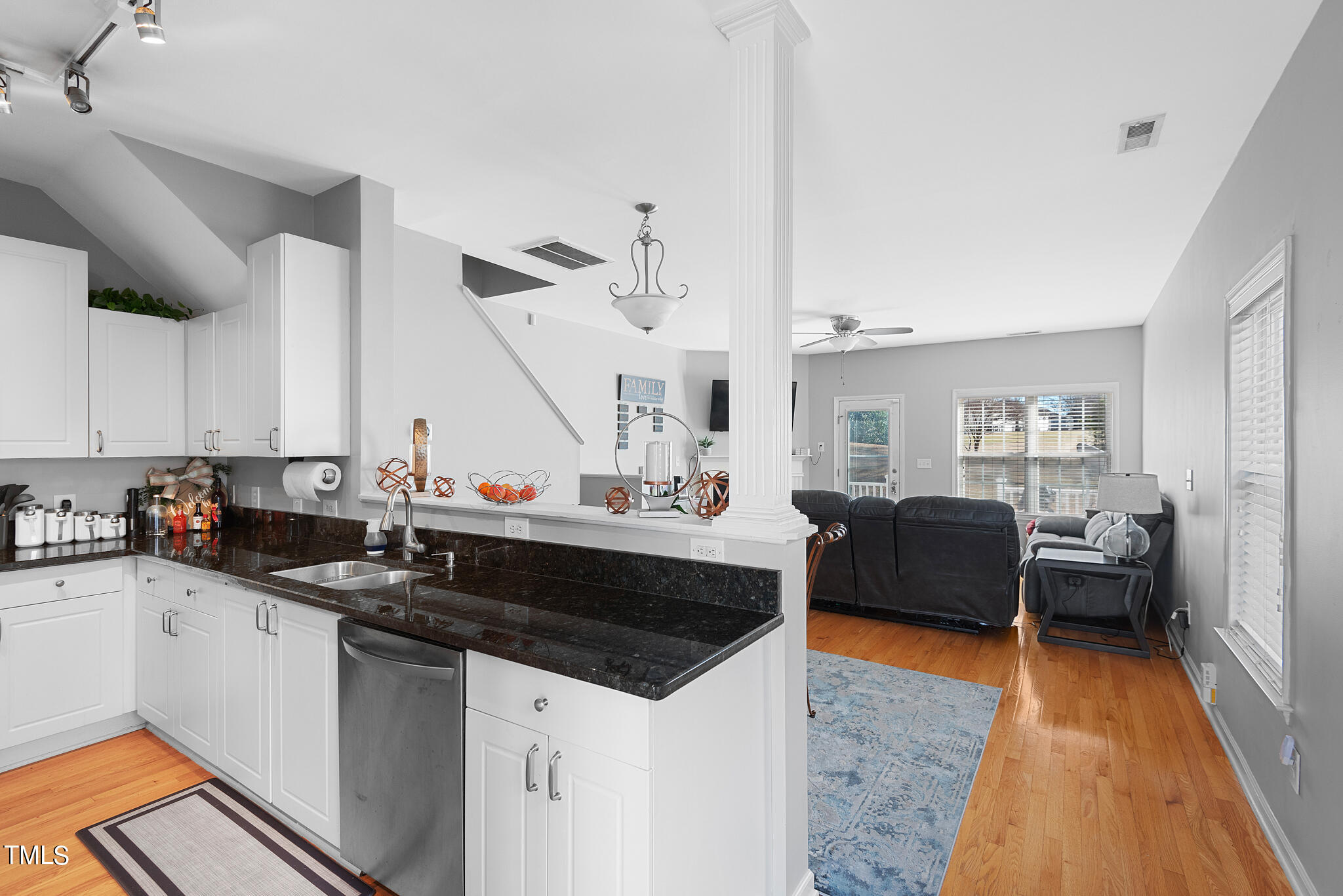 5324 Eagle Trace Drive Raleigh, NC 27604 - Photo 3 of 26 a kitchen with stainless steel appliances granite countertop a sink dishwasher and a stove with wooden floor