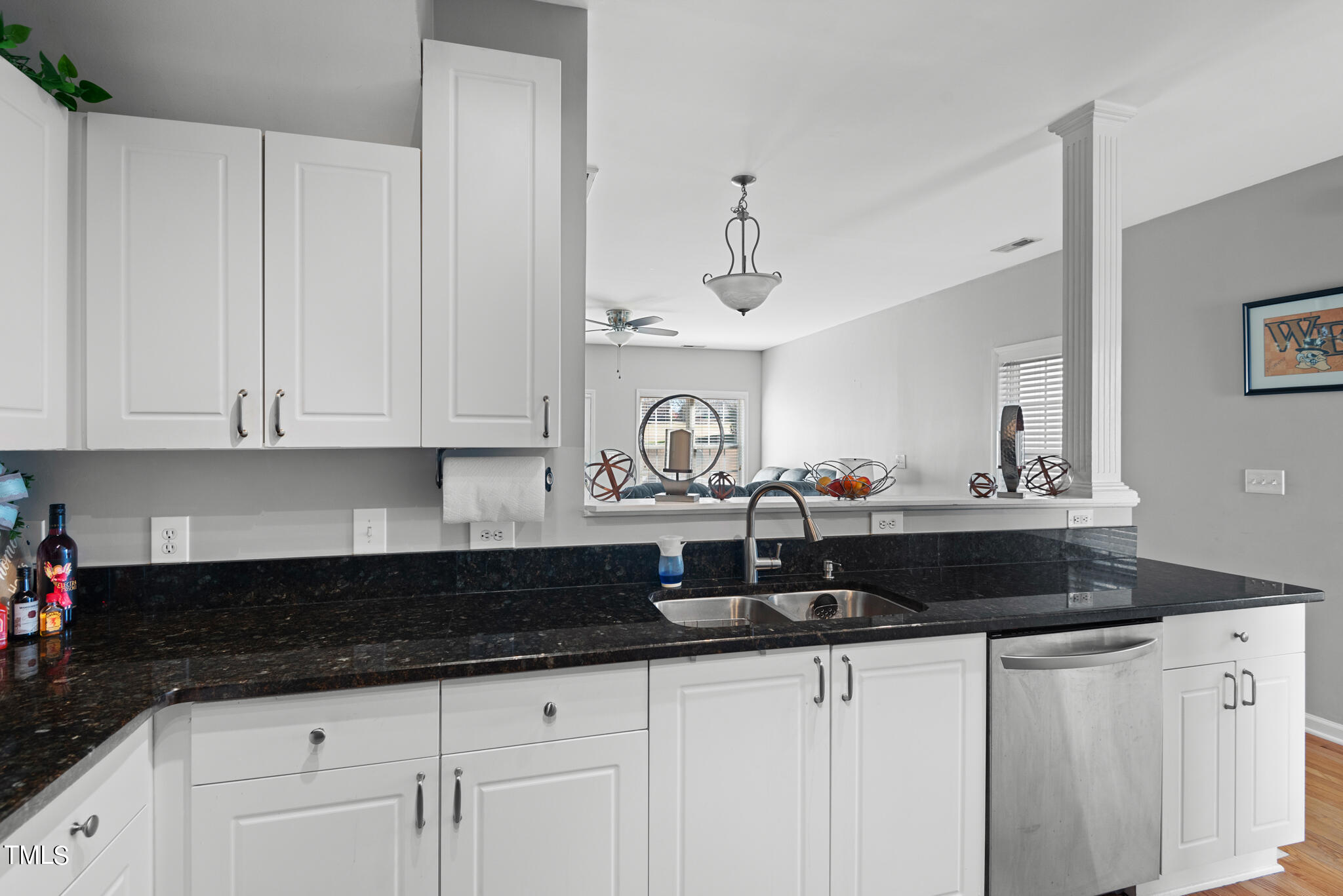 5324 Eagle Trace Drive Raleigh, NC 27604 - Photo 4 of 26 a kitchen with granite countertop white cabinets and sink
