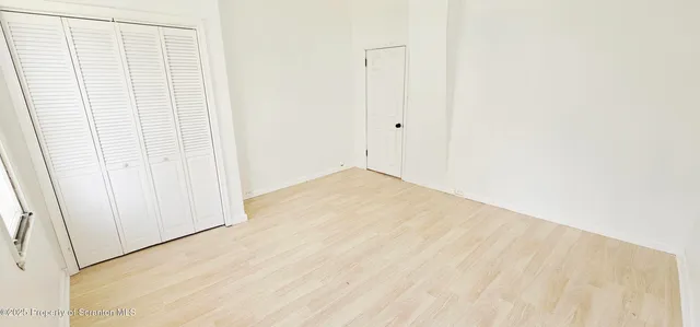a view of small space with wooden floor