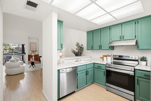 a kitchen with a sink and cabinets