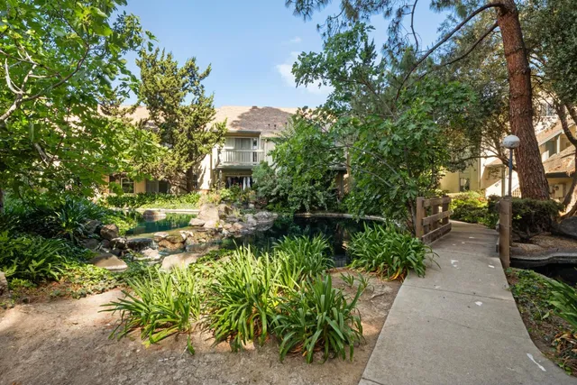 a view of a garden with sitting area