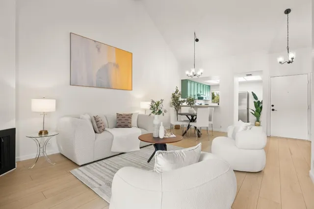 a living room with furniture and a lamp