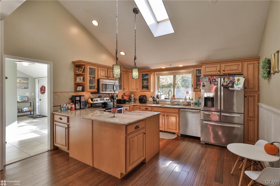 4175 Sherry Hill Road Hellertown, PA 18055 - Photo 17 of 50 a kitchen with stainless steel appliances granite countertop a sink a stove and refrigerator
