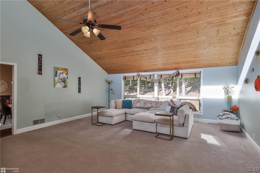 4175 Sherry Hill Road Hellertown, PA 18055 - Photo 24 of 50 a living room with furniture and a chandelier