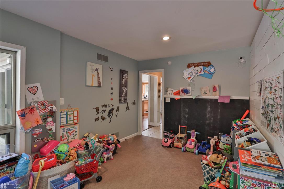 4175 Sherry Hill Road Hellertown, PA 18055 - Photo 26 of 50 a living room with lots of baby toys