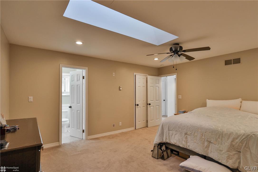 4175 Sherry Hill Road Hellertown, PA 18055 - Photo 31 of 50 a spacious bedroom with a bed and furniture