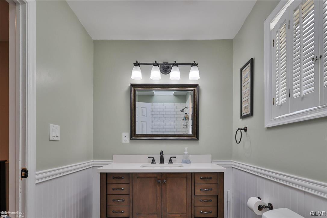 4175 Sherry Hill Road Hellertown, PA 18055 - Photo 33 of 50 a bathroom with a sink and a mirror