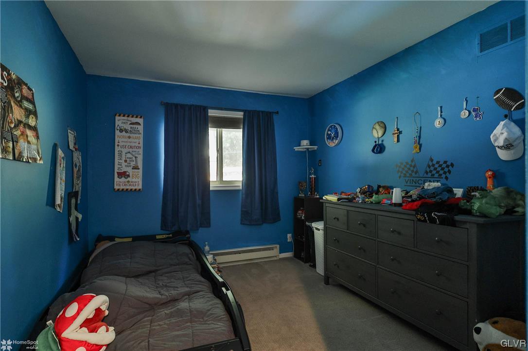 4175 Sherry Hill Road Hellertown, PA 18055 - Photo 35 of 50 a bedroom with a bed and cabinets