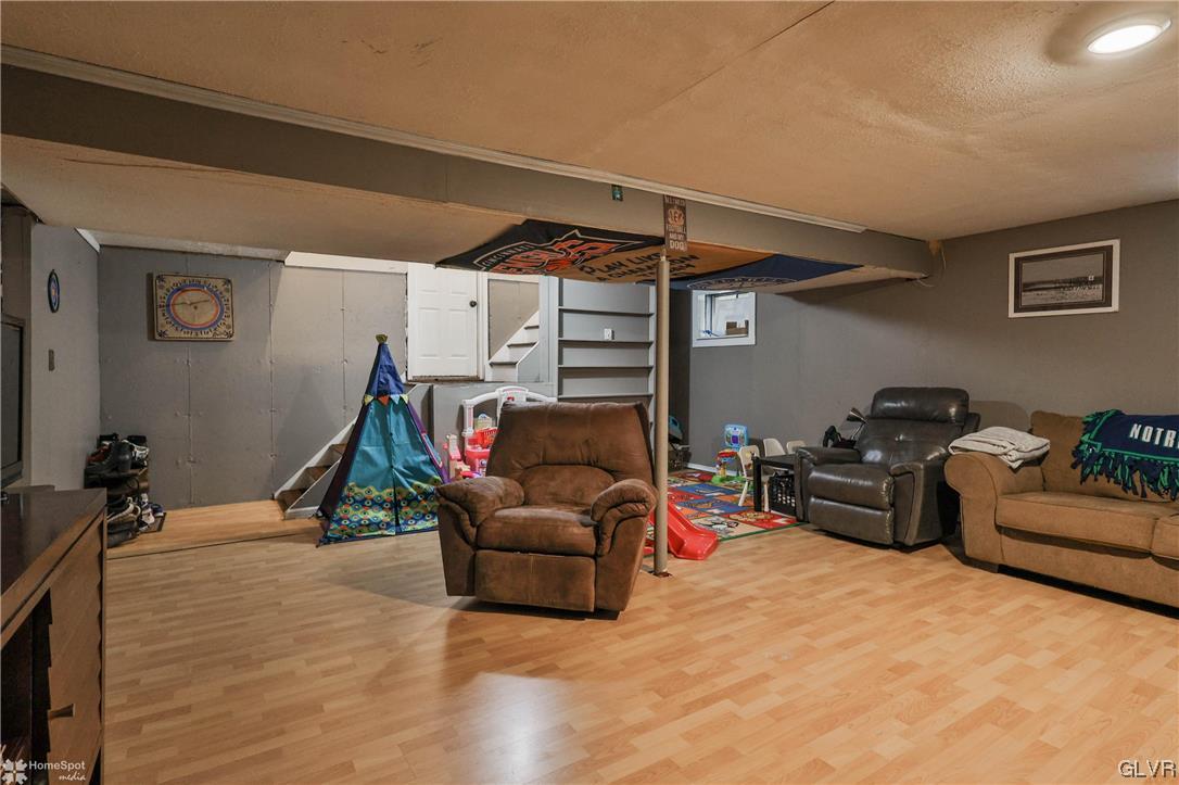 4175 Sherry Hill Road Hellertown, PA 18055 - Photo 44 of 50 a living room with furniture a gym equipment and a couch