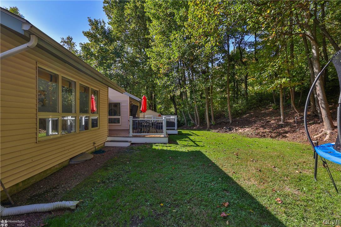 4175 Sherry Hill Road Hellertown, PA 18055 - Photo 46 of 50 a view of a chair and table in backyard of the house