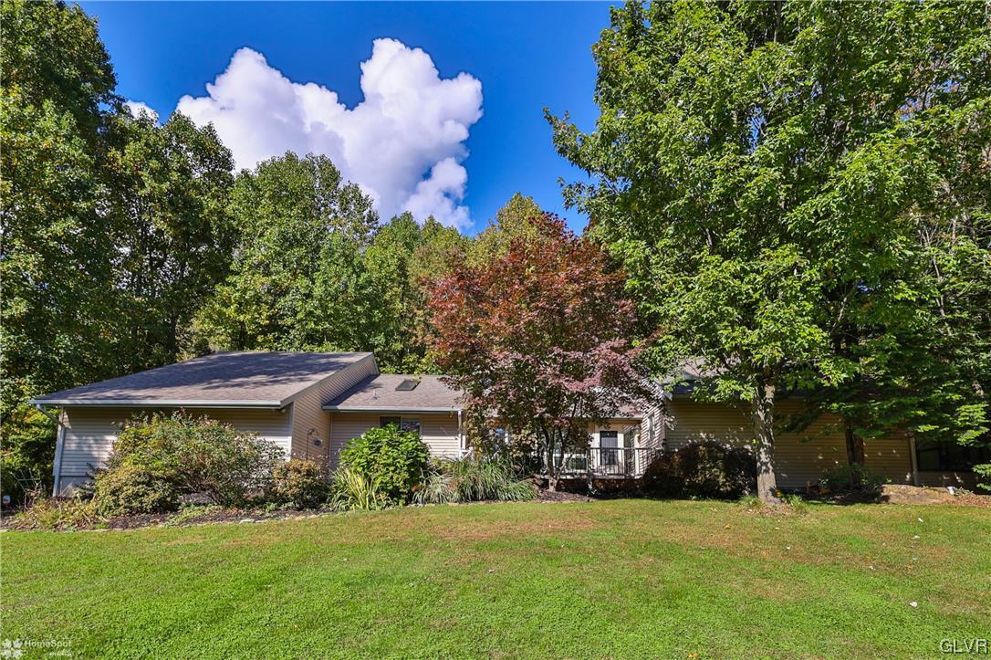 4175 Sherry Hill Road Hellertown, PA 18055 - Photo 6 of 50 a front view of a house with a yard and garage