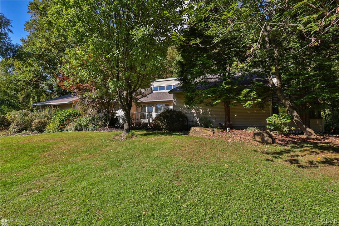 4175 Sherry Hill Road Hellertown, PA 18055 - Photo 7 of 50 a front view of a house with a yard and a tree