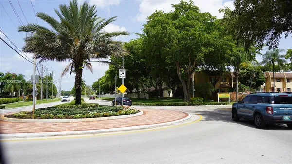 a view of a park with plants and trees