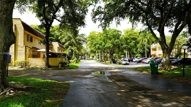 a view of a street with houses on both side