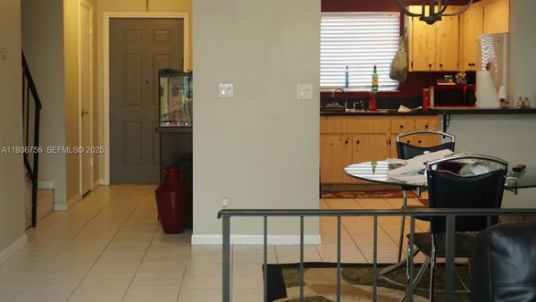 a table with a vase and flowers