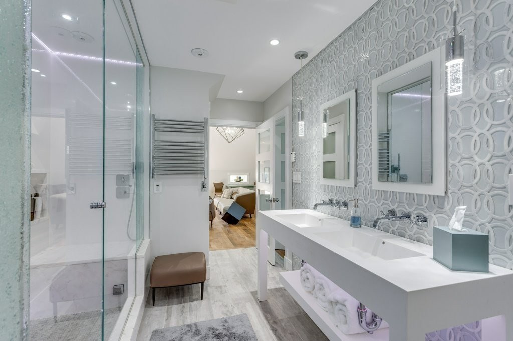 7 Brewer Street, Unit 2 Boston, MA 02130 - Photo 13 of 18 a bathroom with a double vanity sink a toilet and shower