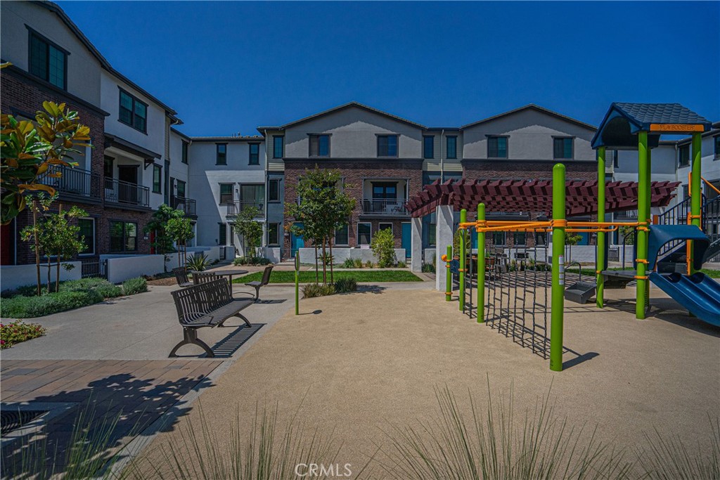 6972 Sagebrush Circle Buena Park, CA 90621 - Photo 6 of 7 a wooden bench sitting in front of a house