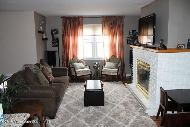 153 Queen Ann Road Brick, NJ 08723 - Photo 4 of 17 Living Room W/ Wood Burning Fireplace