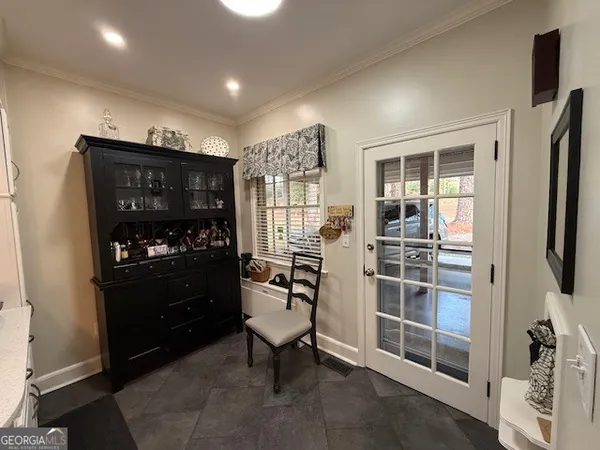 a view of a entryway with furniture and floor to ceiling window