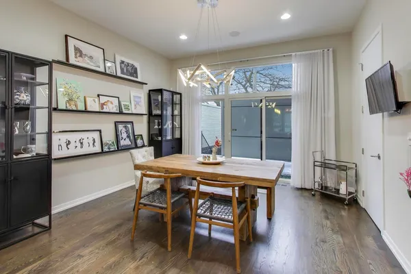 a view of a dining room with furniture and wooden floor