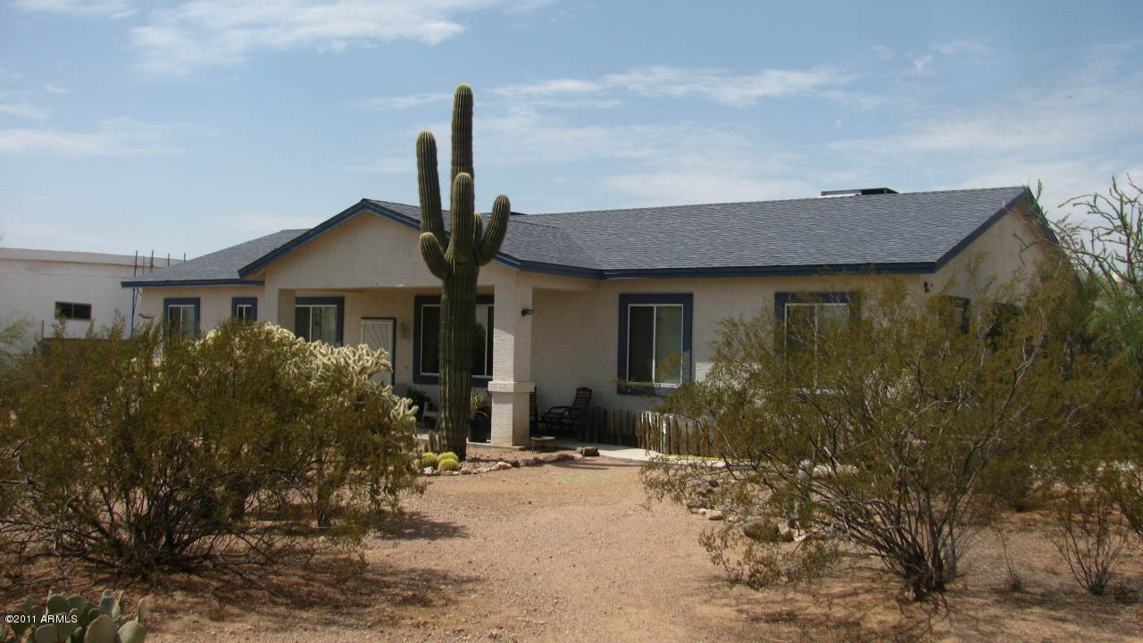 4126 North Colt Road Apache Junction, AZ 85119 - Photo 1 of 18 a front view of a house with garden