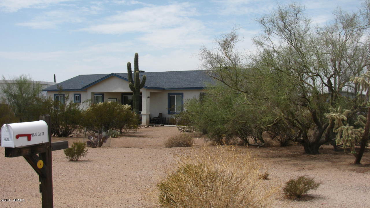 4126 North Colt Road Apache Junction, AZ 85119 - Photo 2 of 18 a front view of a house with garden