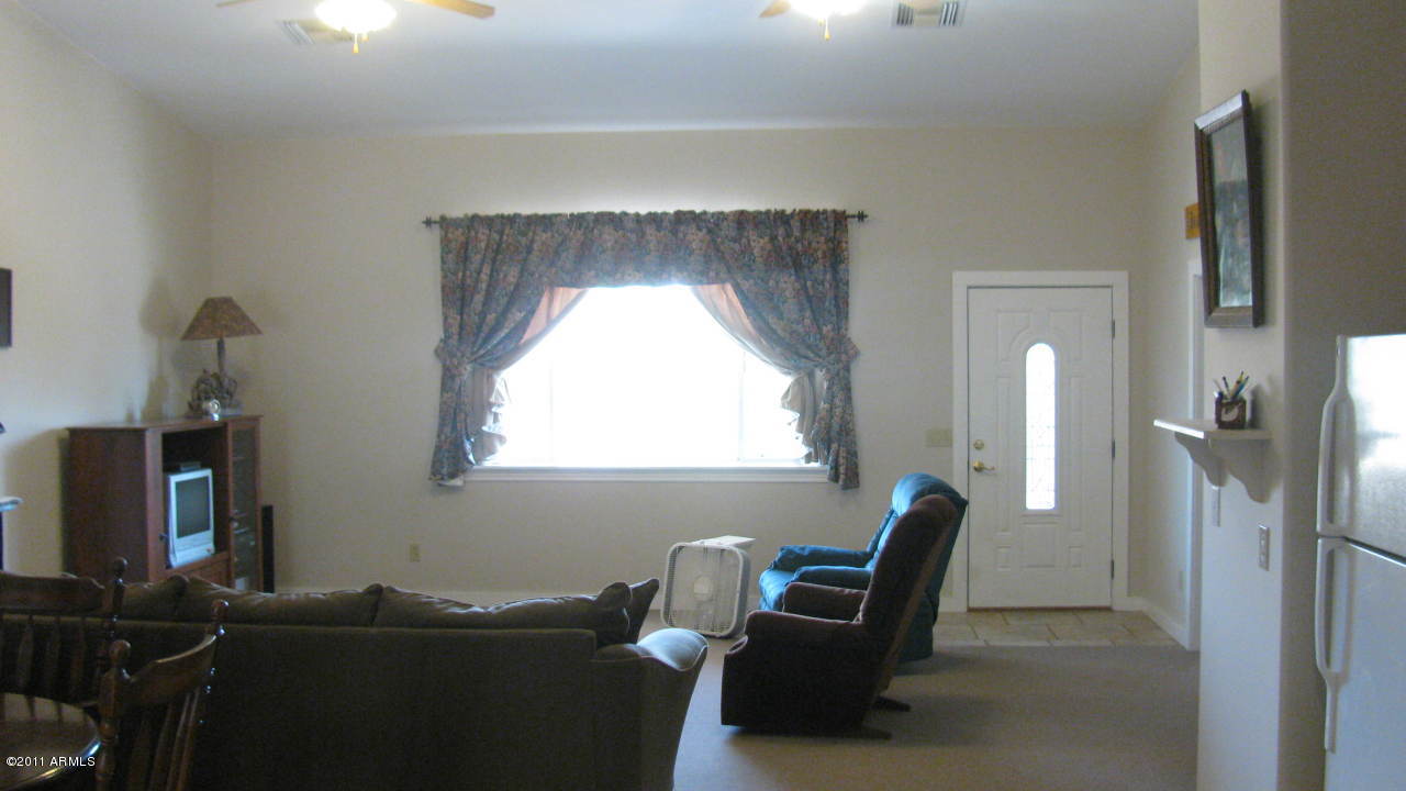 4126 North Colt Road Apache Junction, AZ 85119 - Photo 5 of 18 a living room with furniture and a window