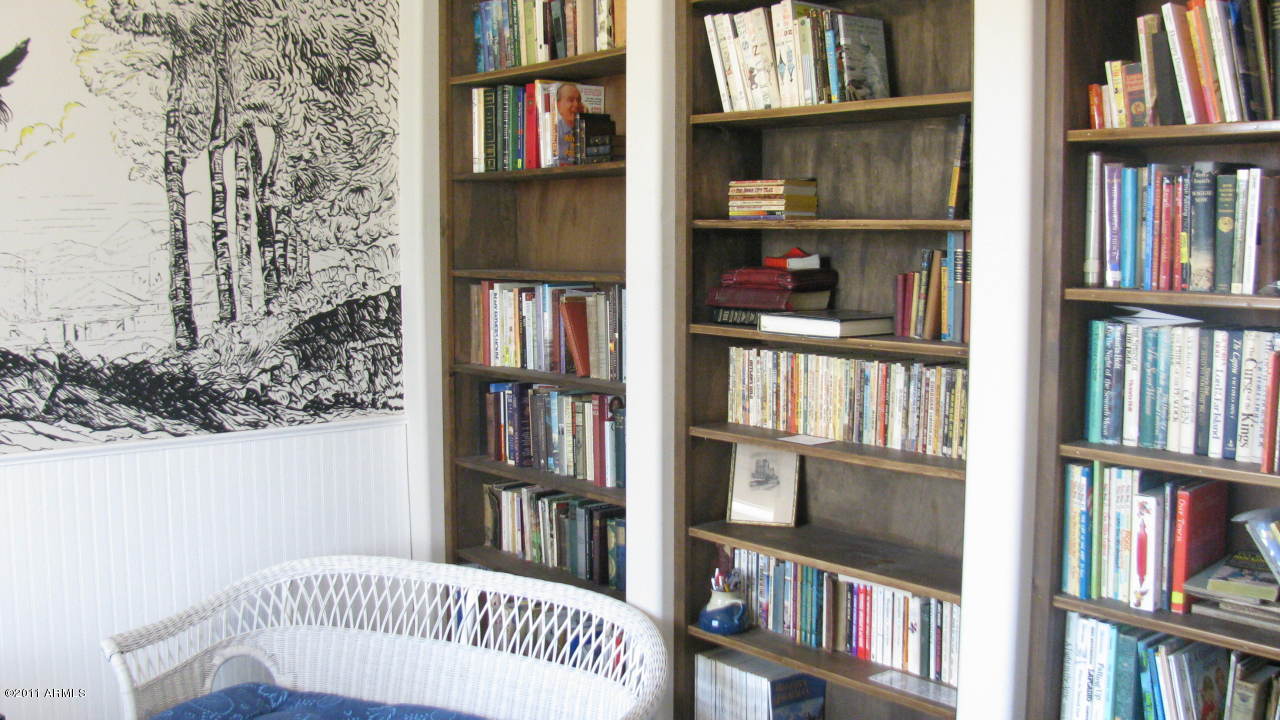 4126 North Colt Road Apache Junction, AZ 85119 - Photo 6 of 18 a bedroom with a book shelf