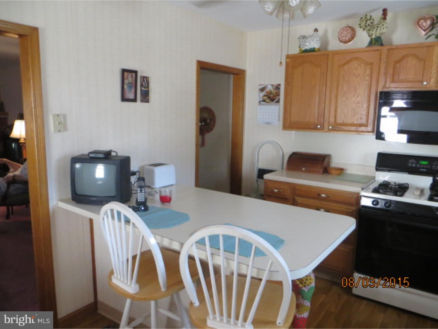 237 Powell Road Springfield, PA 19064 - Photo 11 of 25 a dining room with furniture and wooden floor
