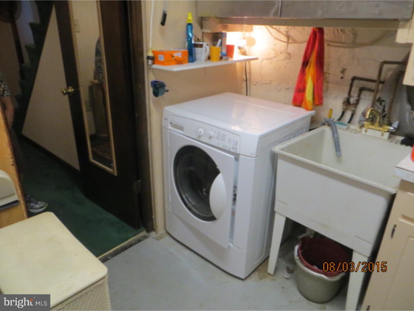 237 Powell Road Springfield, PA 19064 - Photo 16 of 25 a utility room with dryer and washer