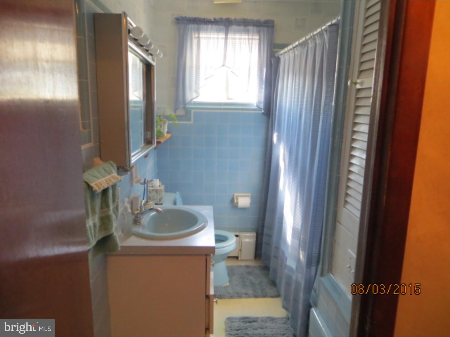 237 Powell Road Springfield, PA 19064 - Photo 18 of 25 a bathroom with a sink and a mirror