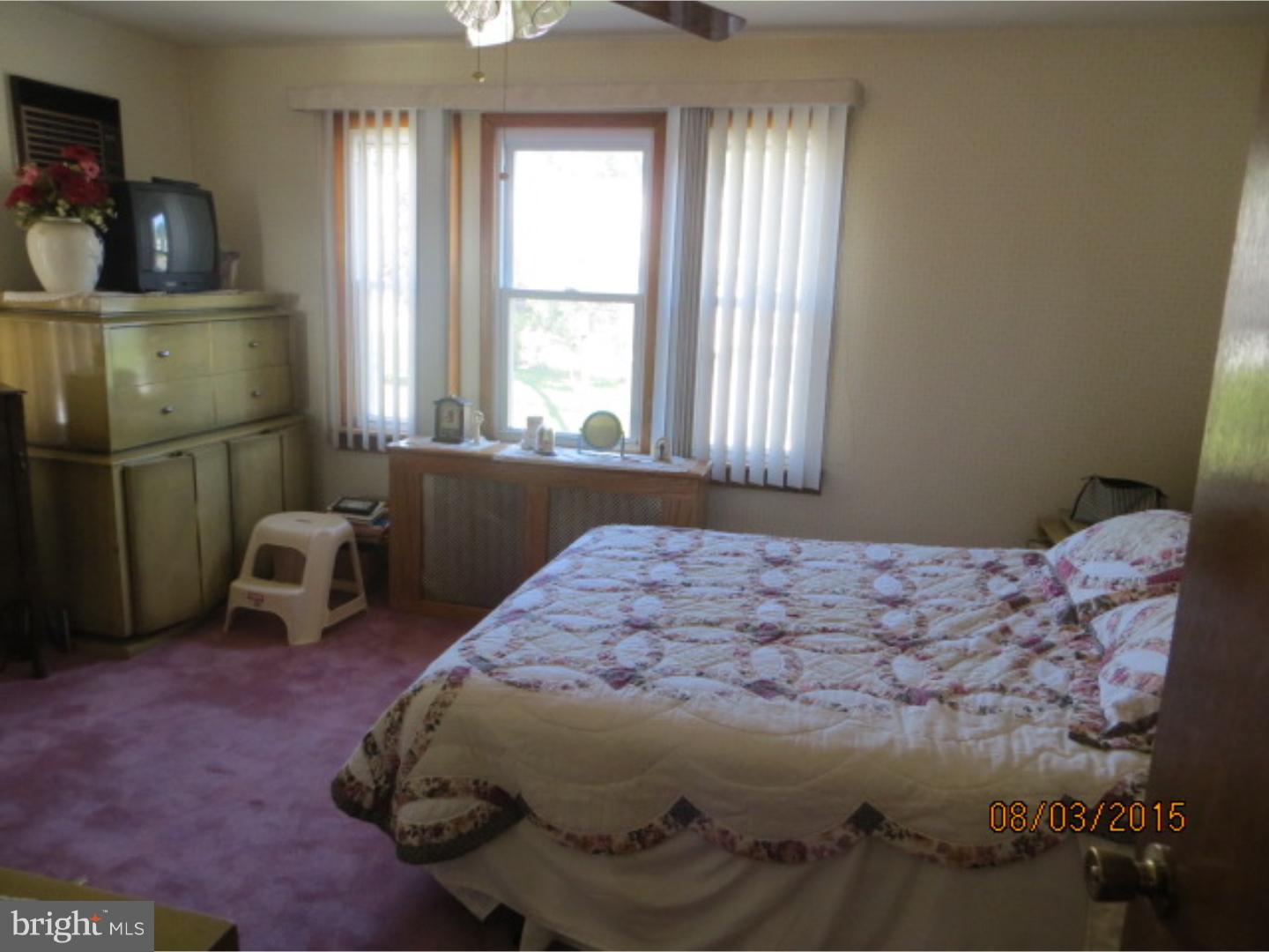 237 Powell Road Springfield, PA 19064 - Photo 21 of 25 a bedroom with a bed and a window