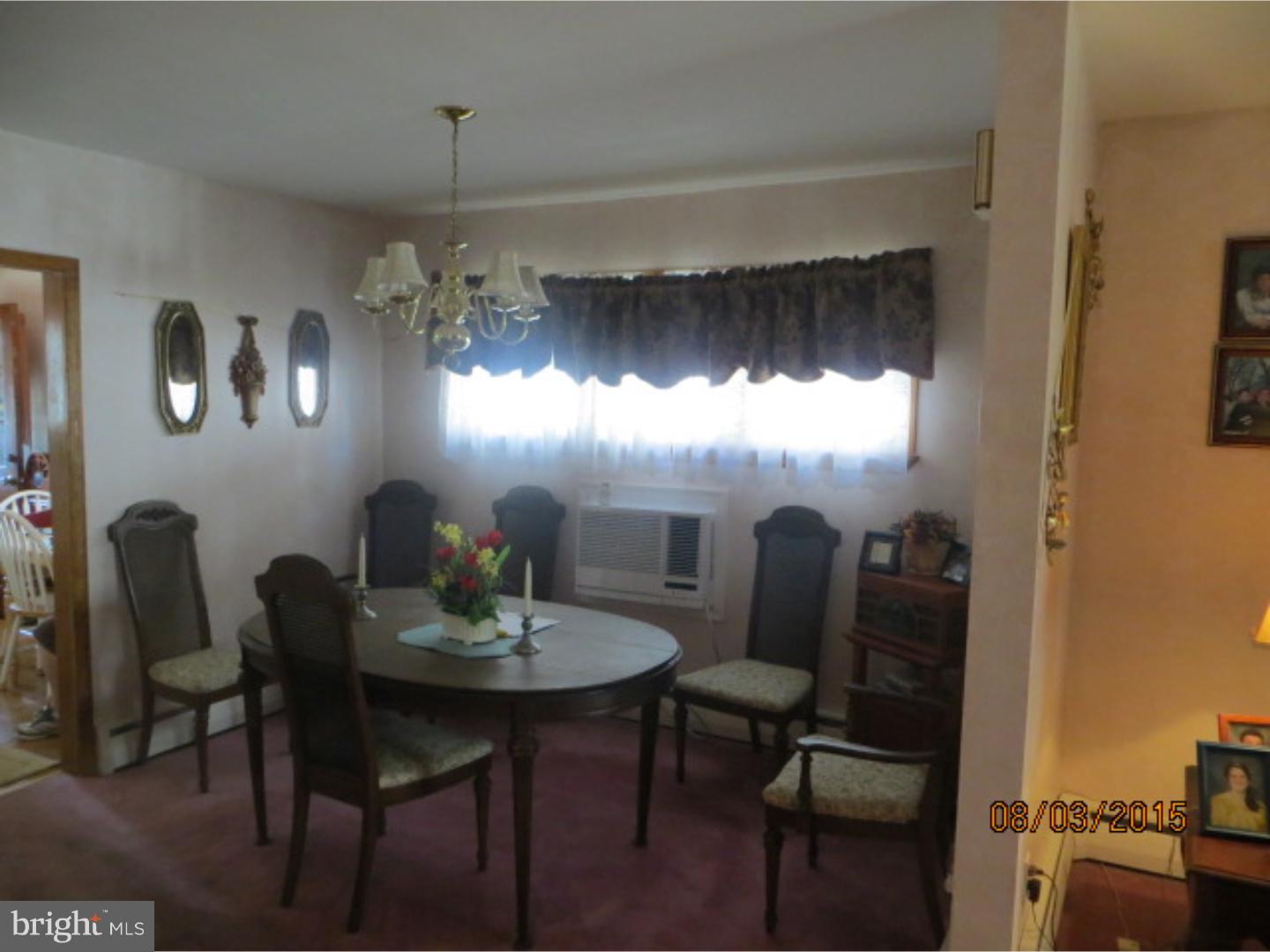 237 Powell Road Springfield, PA 19064 - Photo 4 of 25 a view of a dining room with furniture and chandelier