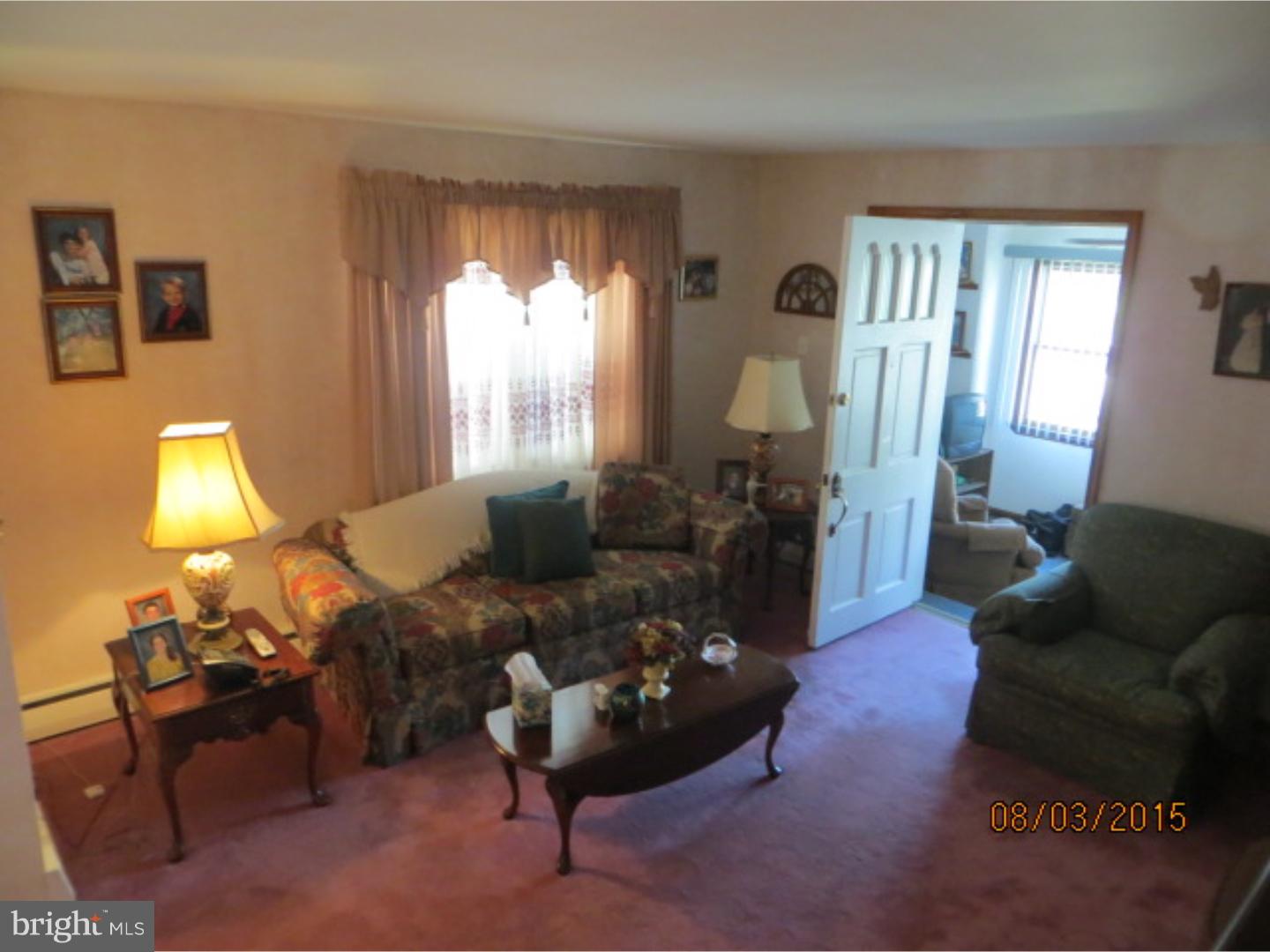 237 Powell Road Springfield, PA 19064 - Photo 5 of 25 a living room with furniture and a large window