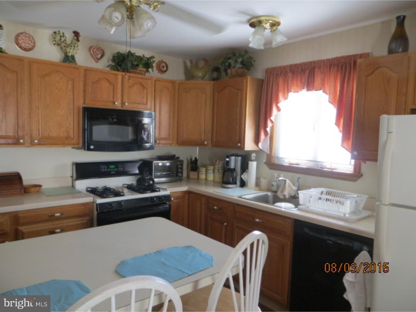 237 Powell Road Springfield, PA 19064 - Photo 10 of 25 a kitchen with a sink appliances and cabinets