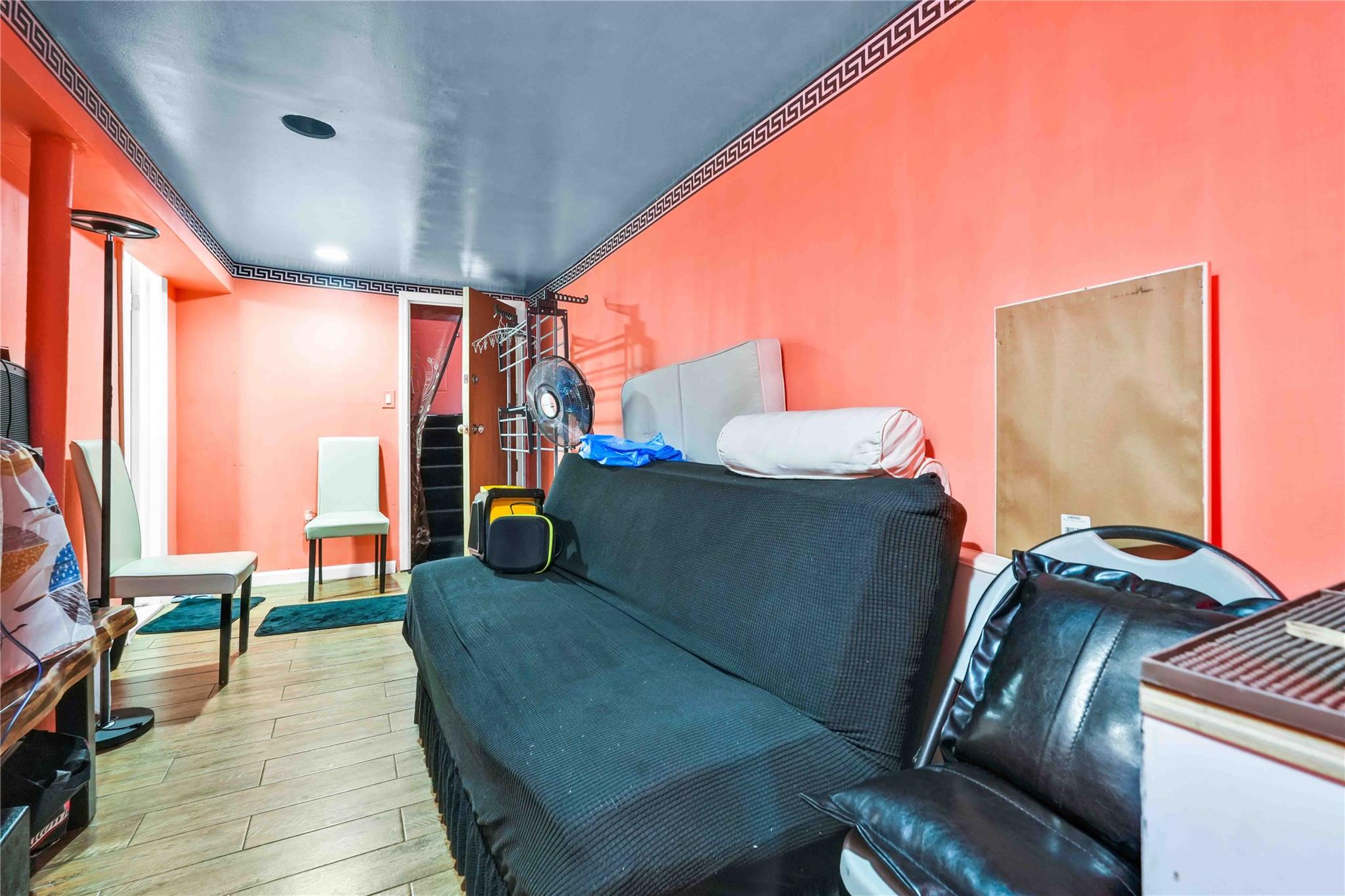 109-55 Lefferts Boulevard Queens, NY 11420 - Photo 18 of 21 a living room with furniture and a balcony