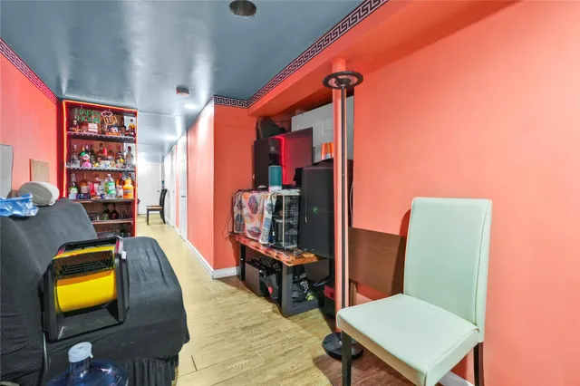 a living room with furniture wall and a flat screen tv