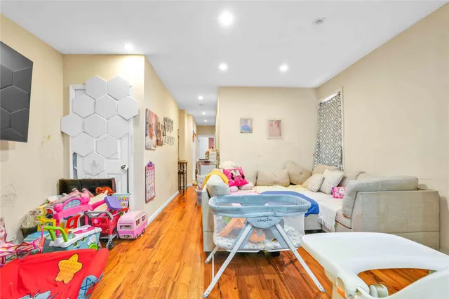 a view of a dining room with furniture and toys
