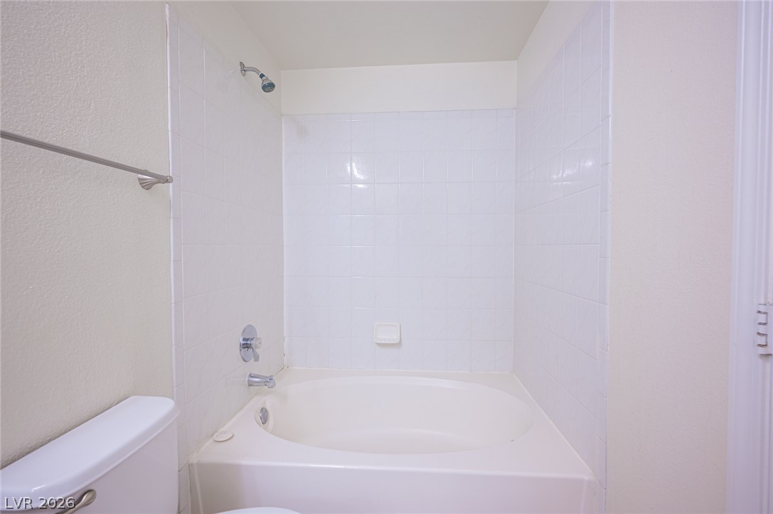 8555 West Russell Road, Unit 2062 Las Vegas, NV 89113 - Photo 24 of 35 A well-maintained tub-shower combination offers a pristine bathing experience.