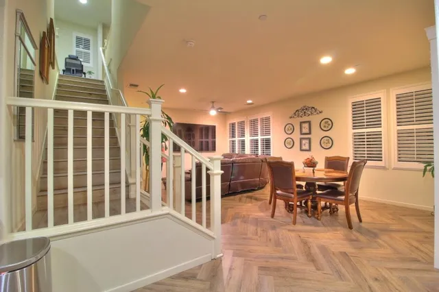 a view of a dining room with furniture window and wooden floor